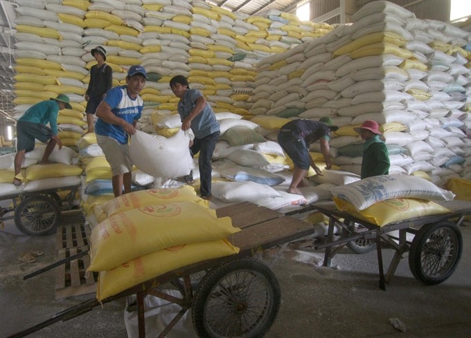 Rice packs are loaded at Đồng Tháp Food Company. Thailand’s plan to sell 11.4 million tonnes of rice in May and June sparked concerns about the impact it would have on Việt Nam’s rice exports, but some said the effects would not be significant. (Photo: VNA/VNS)